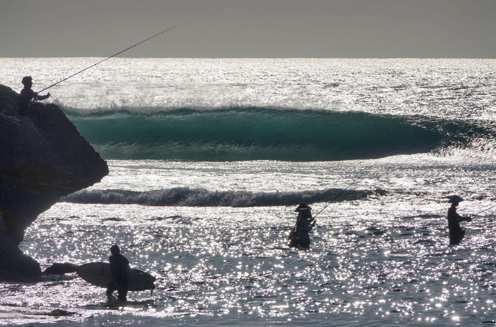 people who were fishing on padang-padang beach