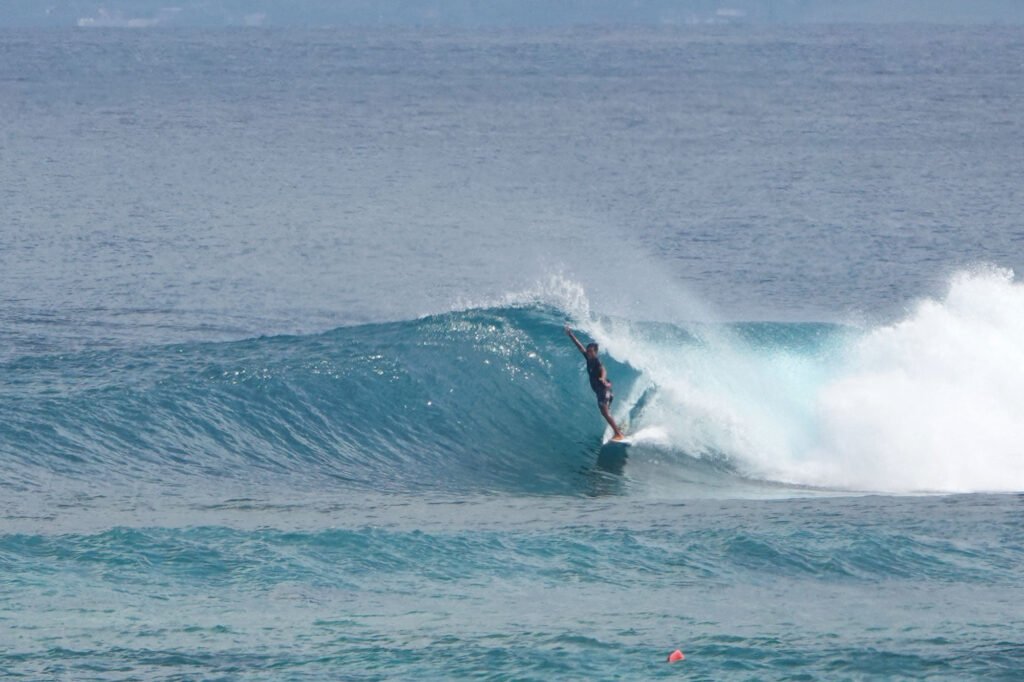 surfer enjoying the waves on bali beach