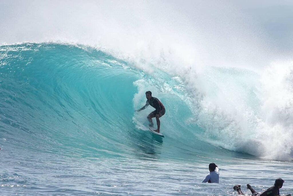 Coming out of a barrel is local Lembongan surfer, Komo Wilson.