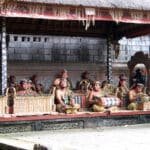 Barong Dance performers and gamelan musicians on stage at Batubulan Village open-air theater, Bali