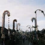 Penjor bamboo poles lining a Balinese village street during Galungan celebrations