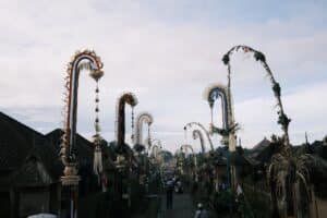 Penjor bamboo poles lining a Balinese village street during Galungan celebrations